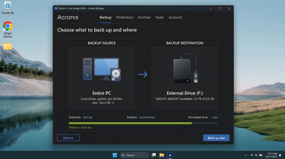 Acronis True Image backup creation screen on Windows showing two large icons, one for the entire PC as the source and one for an external USB drive as the destination.