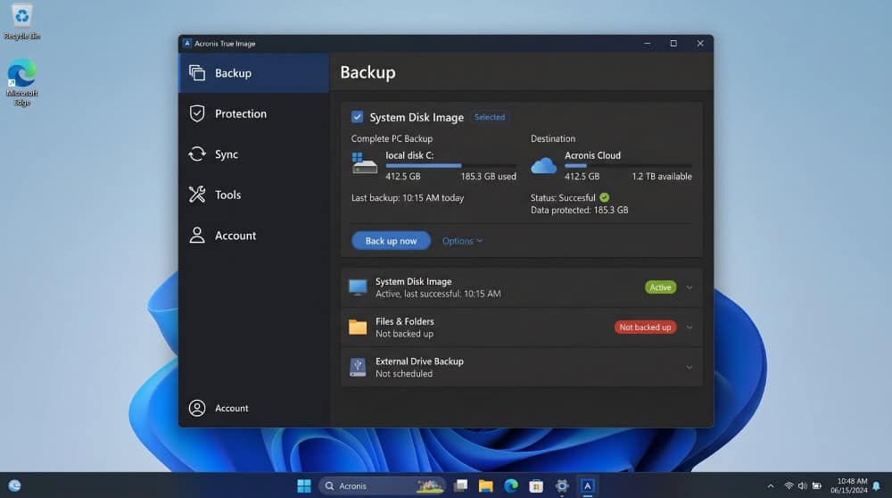 Acronis True Image left-rail navigation on Windows 11 showing the Backup, Protection, Sync, Tools, and Account tabs with the Backup view active.