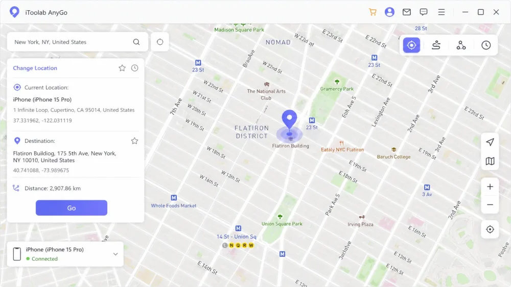 The iToolab AnyGo desktop app showing its main map screen with a search bar, a selected pin dropped on a city street, and a Go button in the corner ready to teleport the connected iPhone's location.