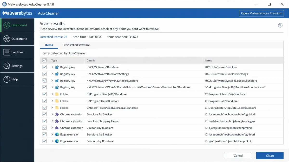 AdwCleaner's results screen listing detected adware registry keys, folders and browser extensions with tick boxes beside each item, ready for the user to deselect a false positive before cleaning.