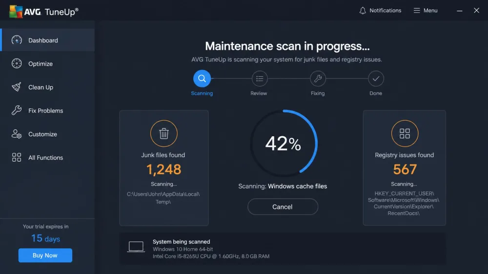 An AVG TuneUp maintenance scan in progress showing counts of junk files and registry issues found.