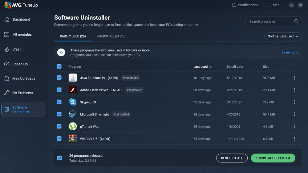The AVG TuneUp Software Uninstaller listing rarely used and preinstalled programs with a bulk-select column for batch removal.
