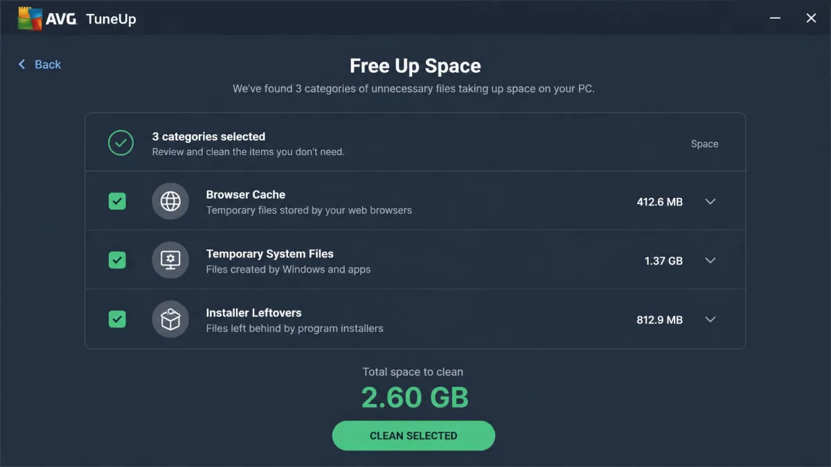 AVG TuneUp's Free Up Space results panel listing browser cache, temporary system files and installer leftovers with checkboxes and a total space figure ready to clean.
