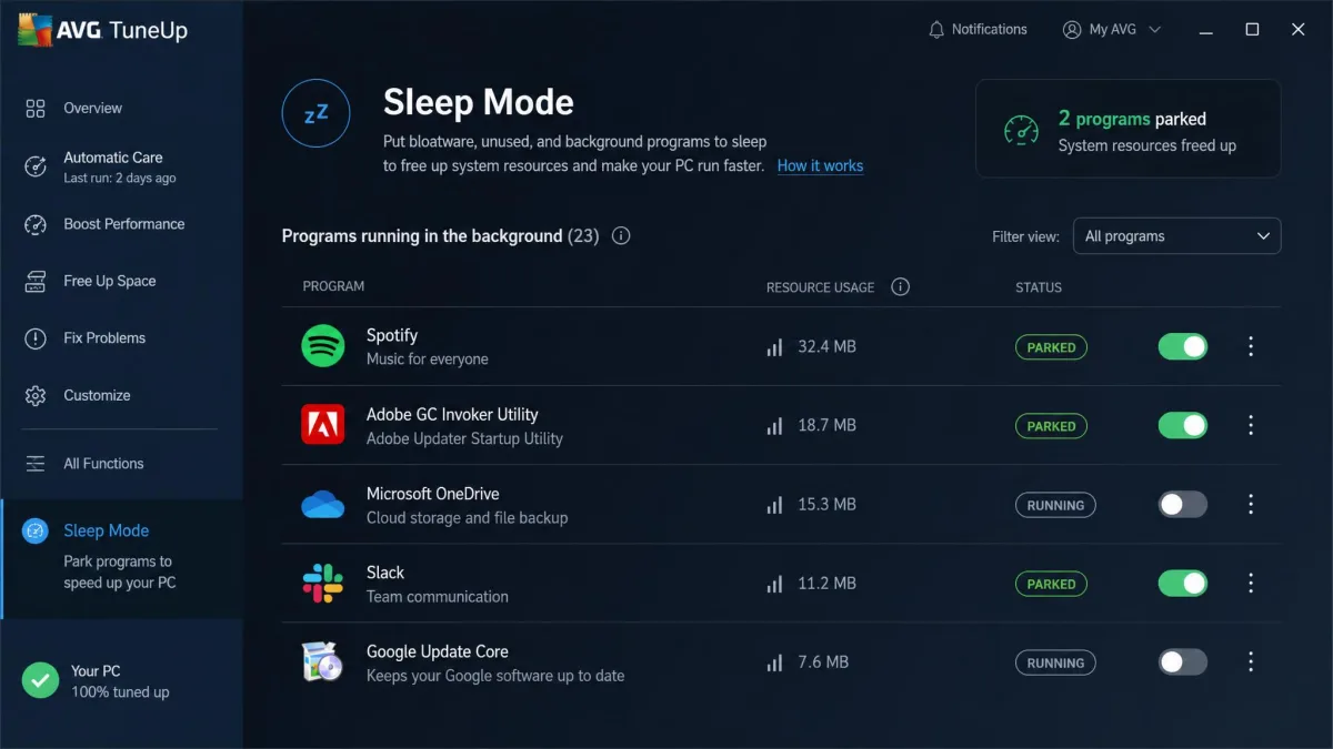 AVG TuneUp's Sleep Mode screen listing background programs such as Spotify and Adobe updater with toggles showing which are currently parked.