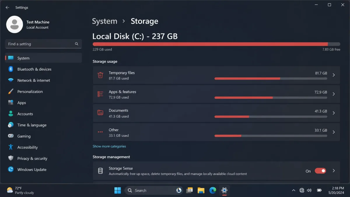 Windows 11 Storage settings on the test machine before a cleanup run, showing the C: drive nearly full with a category breakdown of temporary files, apps and documents.