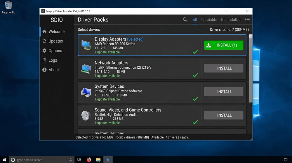 Snappy Driver Installer Origin interface showing driverpacks as selectable tiles with a green install button.