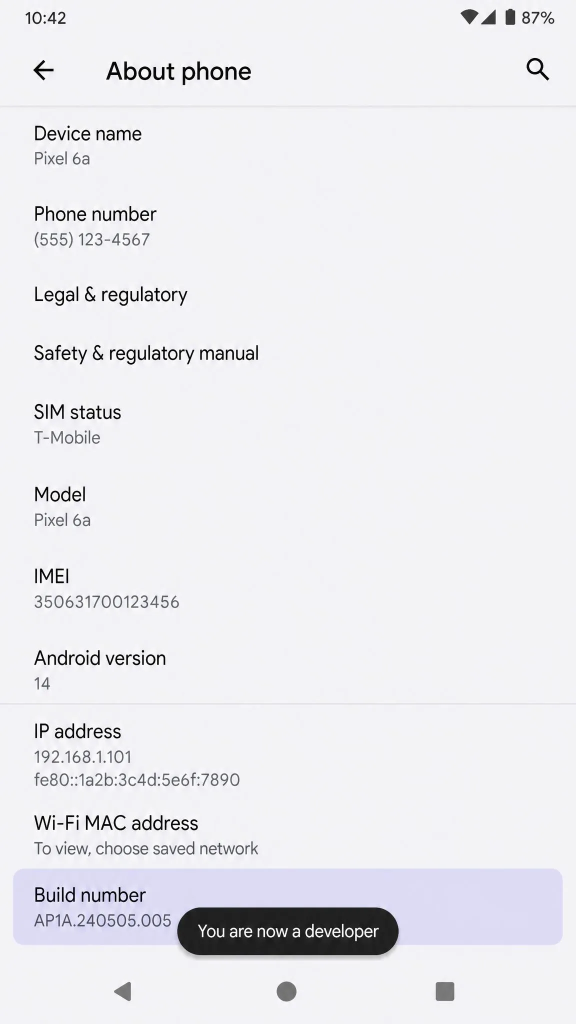 Android About phone screen with the Build number row highlighted and a toast message reading "You are now a developer".