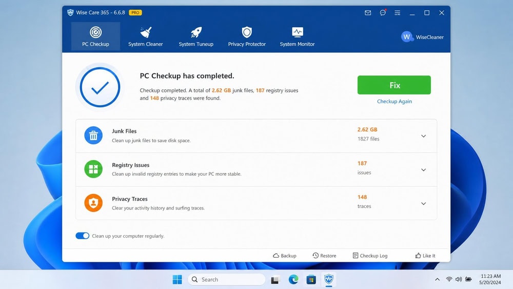 Wise Care 365 one-click PC Checkup on Windows 11 listing junk files, registry issues, and privacy traces with a green "Fix" button.