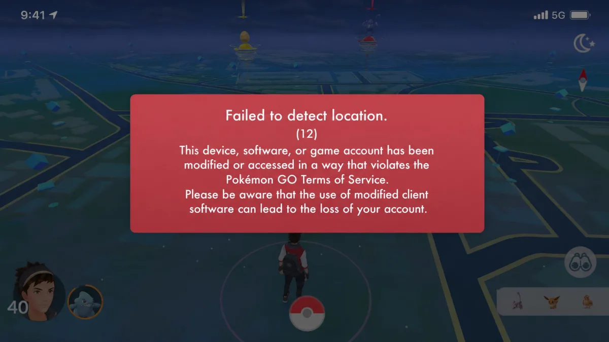 The red cheating warning banner Pokemon GO displays at login on a phone screen, with the game map dimmed behind it.