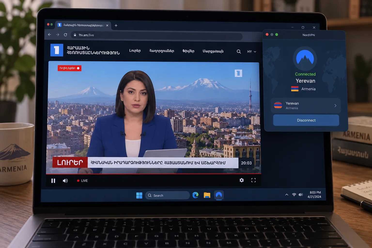 A laptop showing an Armenian TV channel's live stream in a browser, with a VPN app window in the corner connected to the Yerevan location.