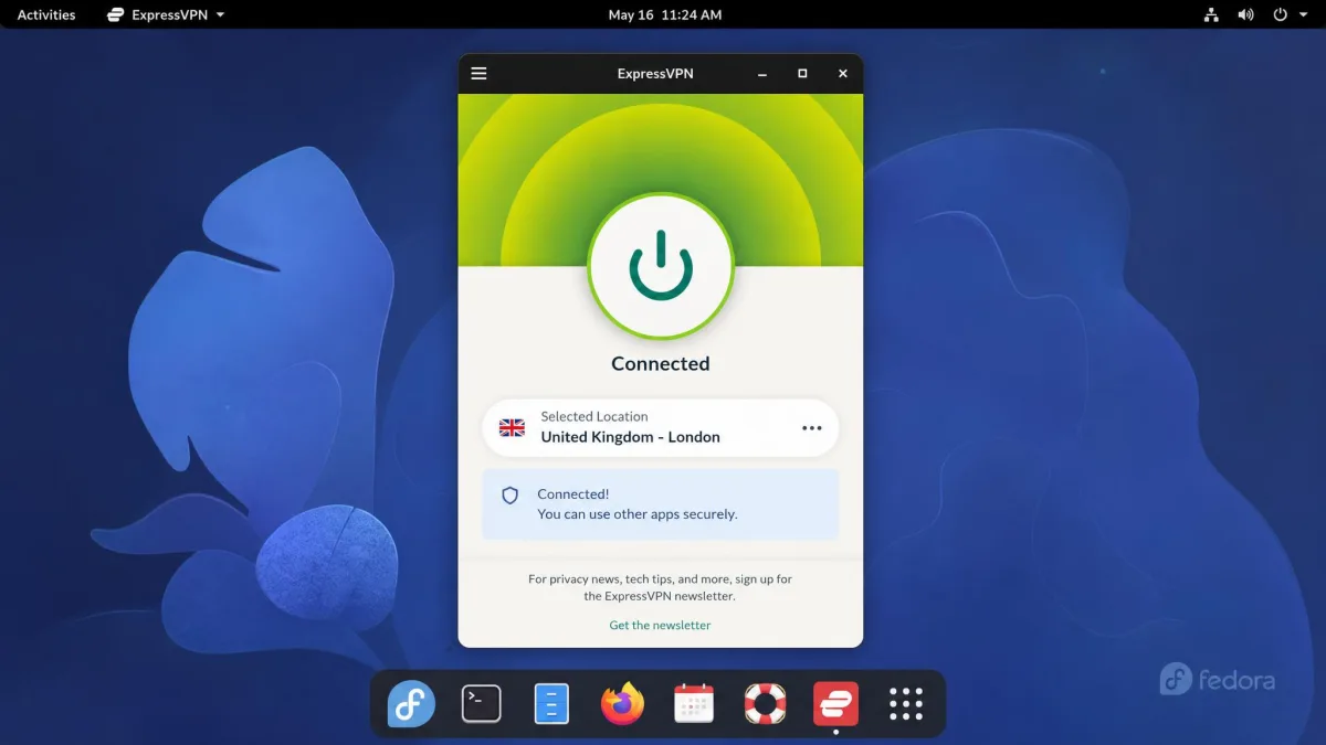 ExpressVPN's Linux app running on Fedora, showing a large connect button in the on state and the selected server location beneath it.