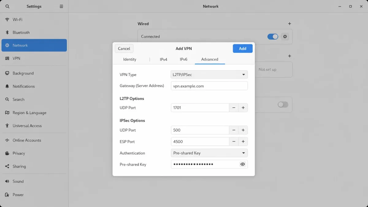 A manual L2TP/IPSec setup dialog on an operating system network panel showing fields for server address, UDP port numbers, and a pre-shared key entered by hand.