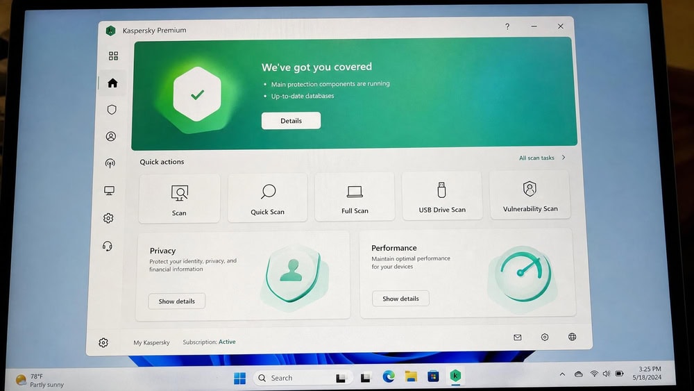 Kaspersky Premium main window on Windows 11 showing the green protection status banner, scan shortcuts, and the privacy and performance tiles.