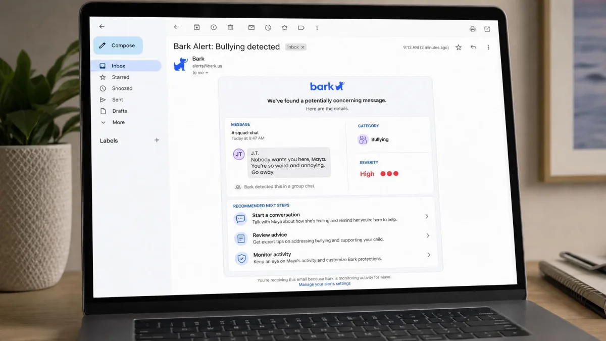 A Bark alert email open on a laptop showing a flagged group chat message categorised as bullying, with the severity label and recommended next steps visible.