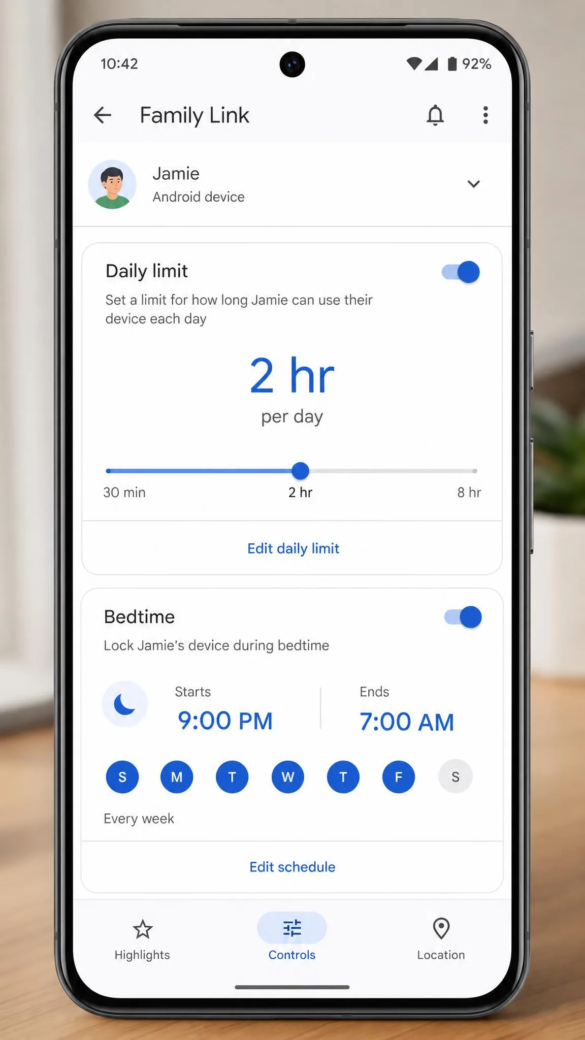 The Google Family Link app open on a parent's phone showing the daily limit screen with a two hour cap set for a child's Android device and a bedtime schedule below it.