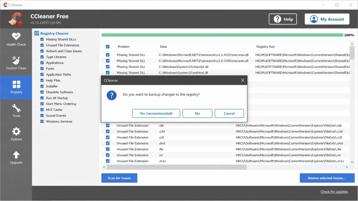 CCleaner's registry cleaner listing missing shared DLLs and obsolete file extensions, with the "Do you want to backup changes to the registry?" dialog open on top.
