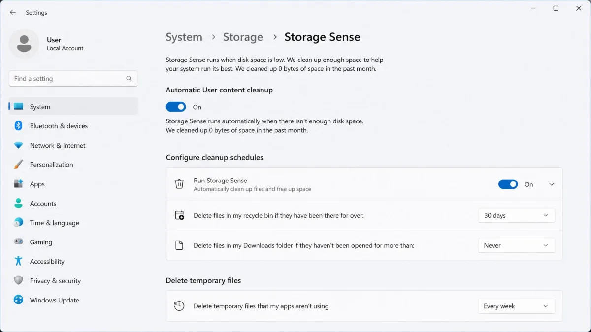 Windows 11's Storage Sense settings page with automatic cleanup toggled on and the temporary-file schedule set to every week.
