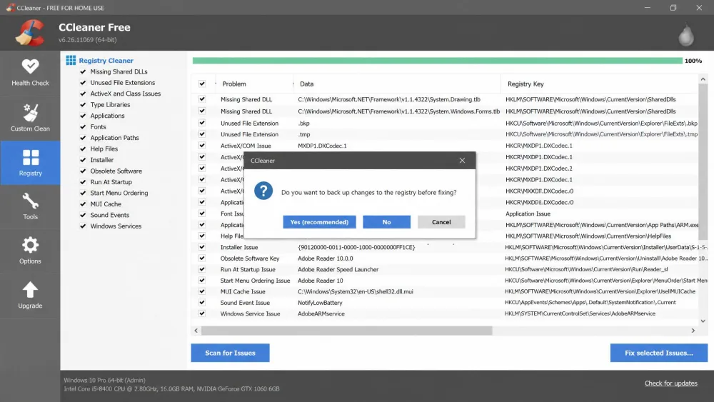 CCleaner's registry cleaner showing a list of detected issues with the backup-before-fixing confirmation dialog open on top.