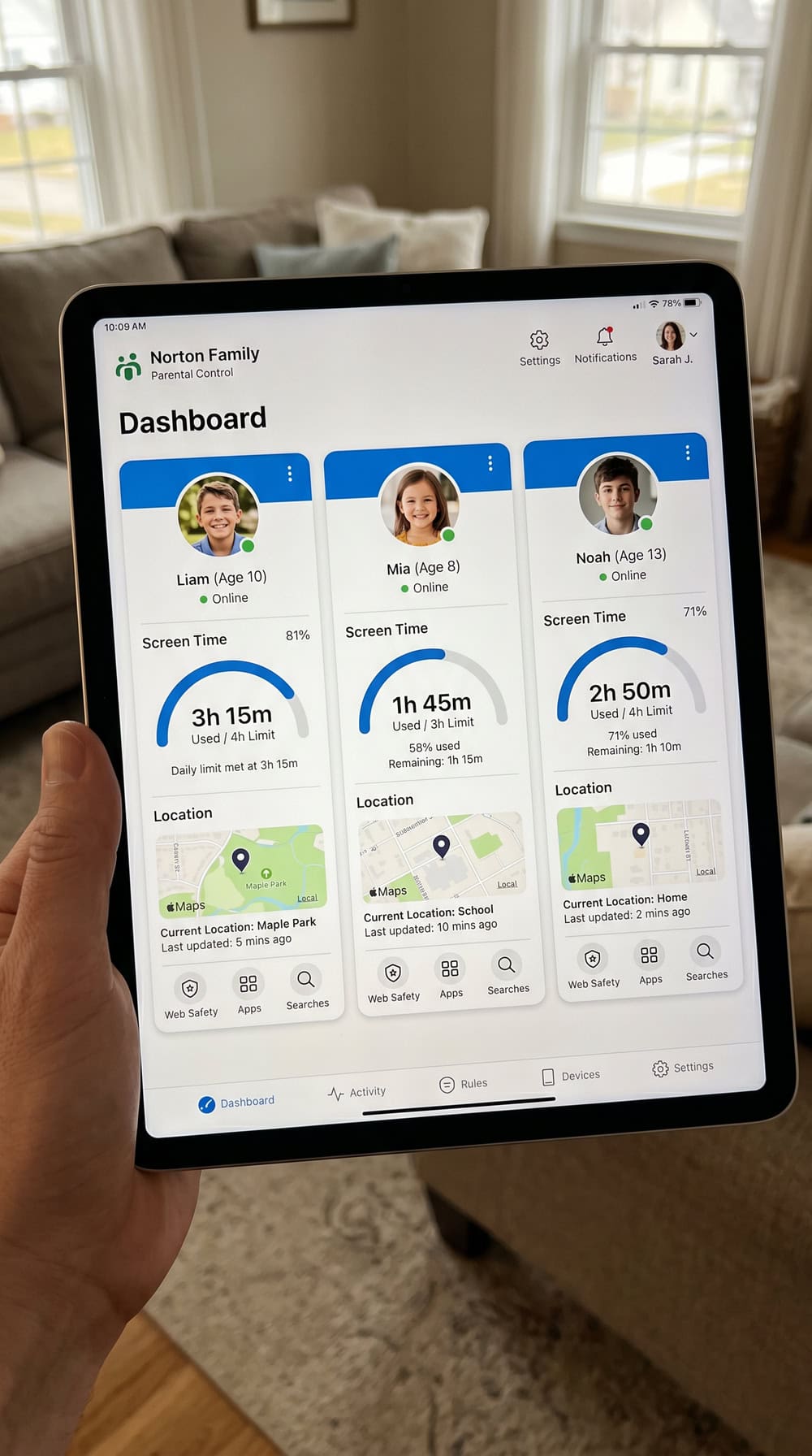 Norton Family dashboard on a tablet showing three children's accounts side by side with screen-time and location summary cards.