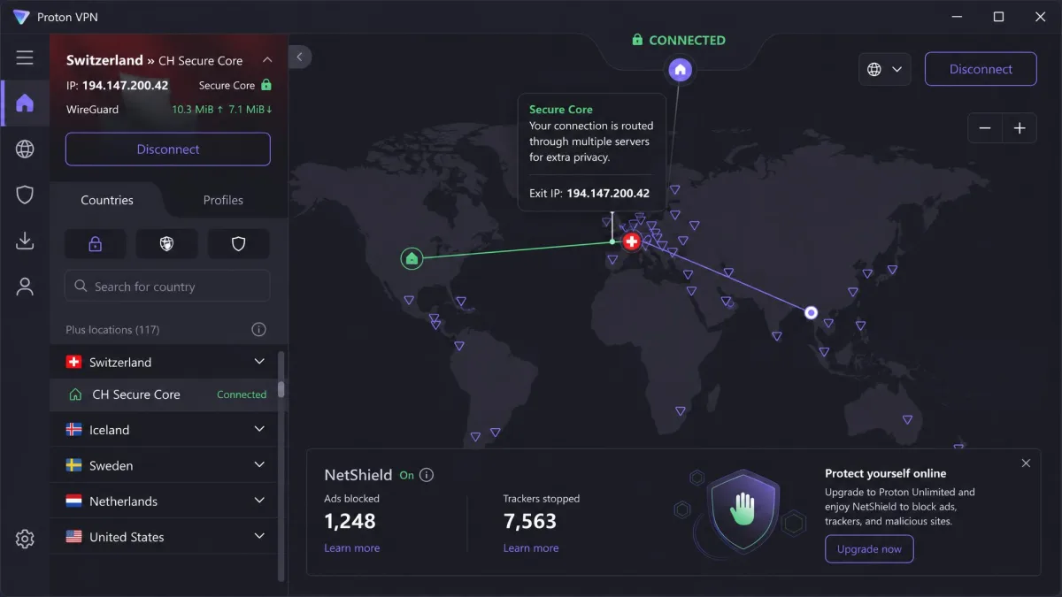 Proton VPN's Windows app connected through a Secure Core server in Switzerland, with the world map showing the multi-hop route and the NetShield ad and tracker blocker switched on.