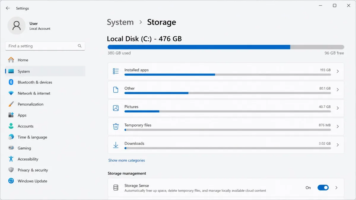 Windows 11 Settings Storage page after cleanup, showing the C: drive capacity bar in blue with 96 GB free of 476 GB and the Temporary files category reduced to under 1 GB.