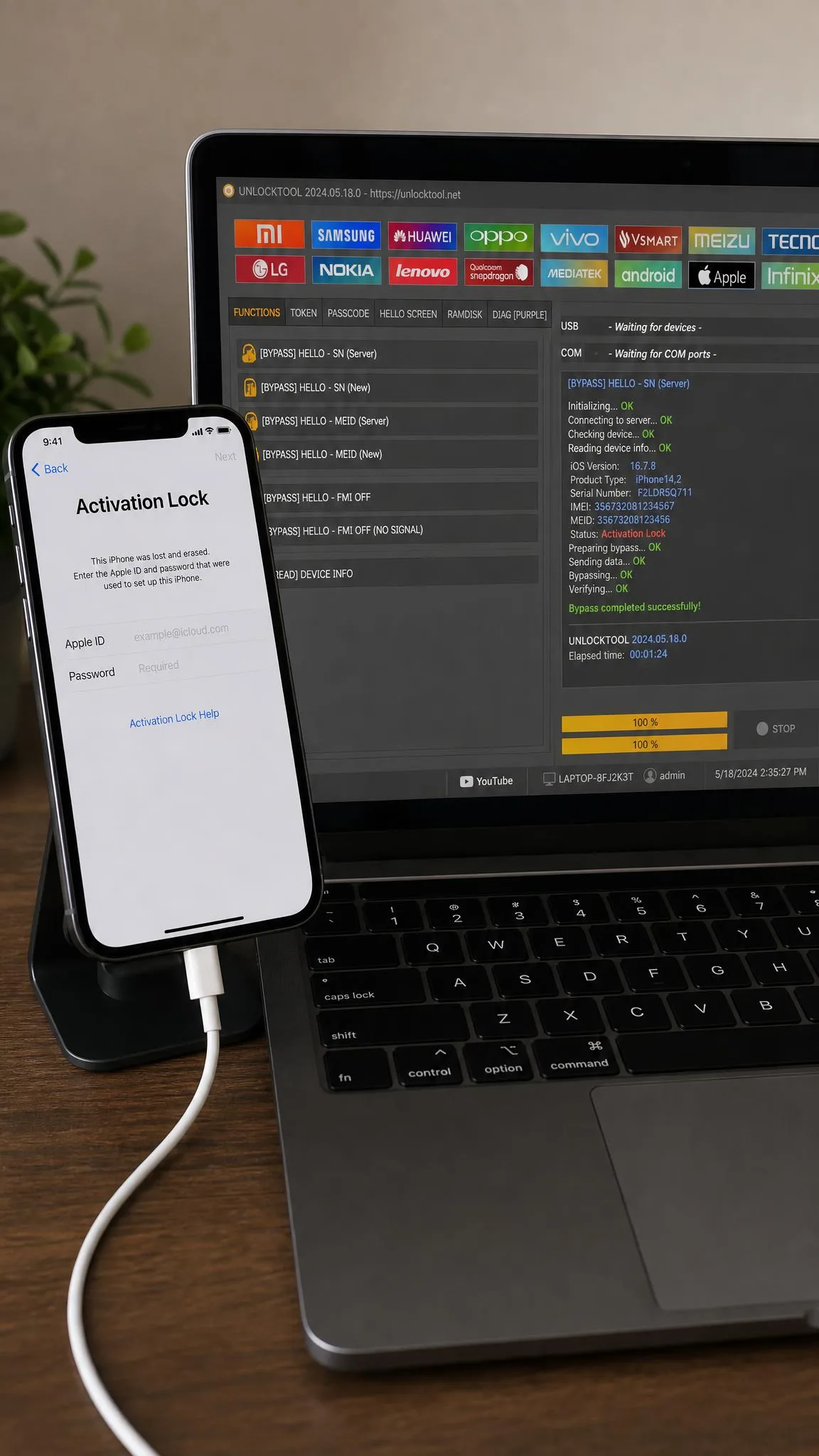 An iPhone on the Activation Lock screen, connected by cable to a laptop running unlock software.