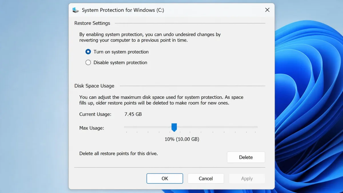 Windows System Protection Configure dialog showing the Max Usage slider, current usage figure and the Delete restore points button.