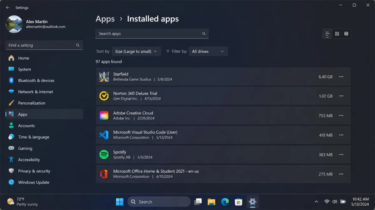 The Windows 11 Installed apps settings page sorted by size, showing a 6.4 GB game and a preinstalled trial security suite near the top of the list.