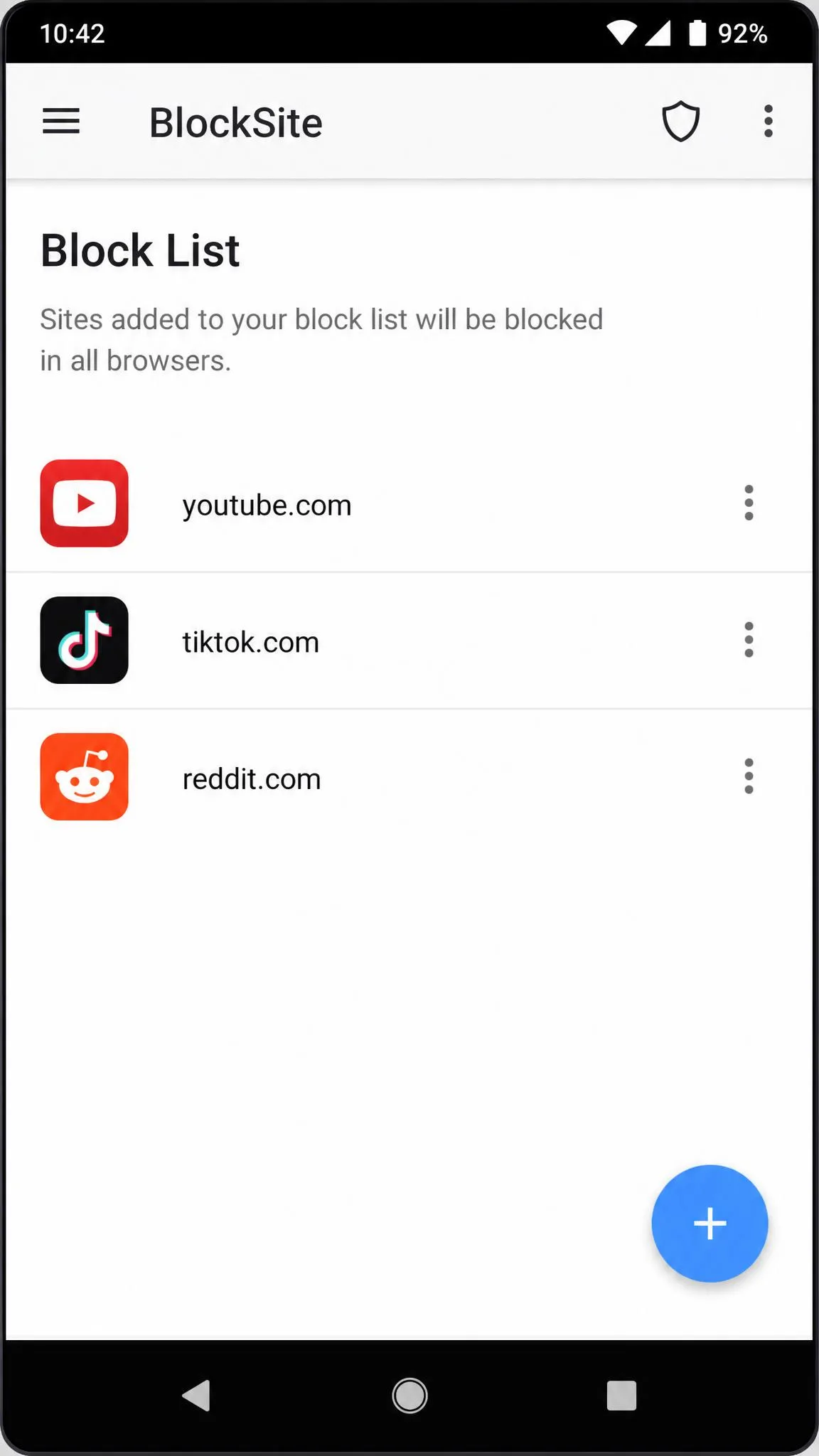 BlockSite's Block List screen on an Android phone with three blocked sites listed and the blue plus button in the lower right corner used to add a new website.