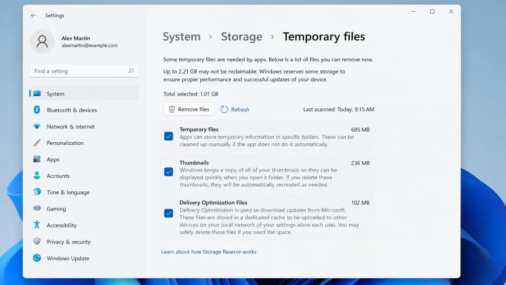The Windows 11 Settings app open on System then Storage then Temporary files, showing checkboxes for Temporary files, Thumbnails, and Delivery Optimization with a Remove files button at the top.