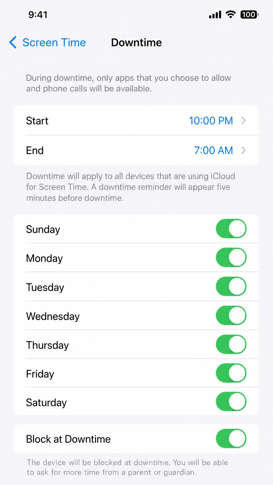 The iOS Screen Time Downtime settings screen showing a schedule from 10:00 PM to 7:00 AM, with the days-of-the-week toggles and Block at Downtime option enabled.