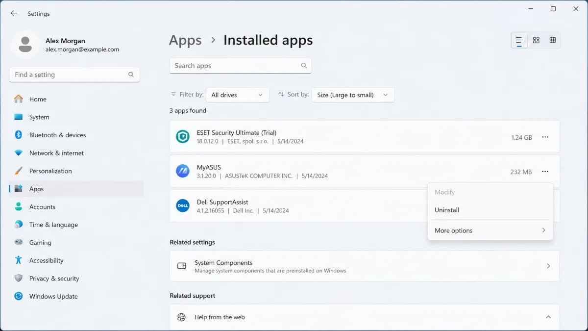 Windows 11 Settings Installed apps list sorted by size, showing a preinstalled trial security suite and two manufacturer utilities with the uninstall menu open.