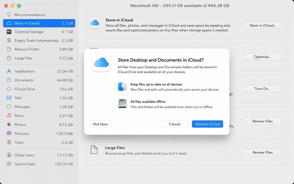macOS Storage recommendations panel with the Store in iCloud option highlighted, showing a dialog to move Desktop and Documents folders to iCloud.