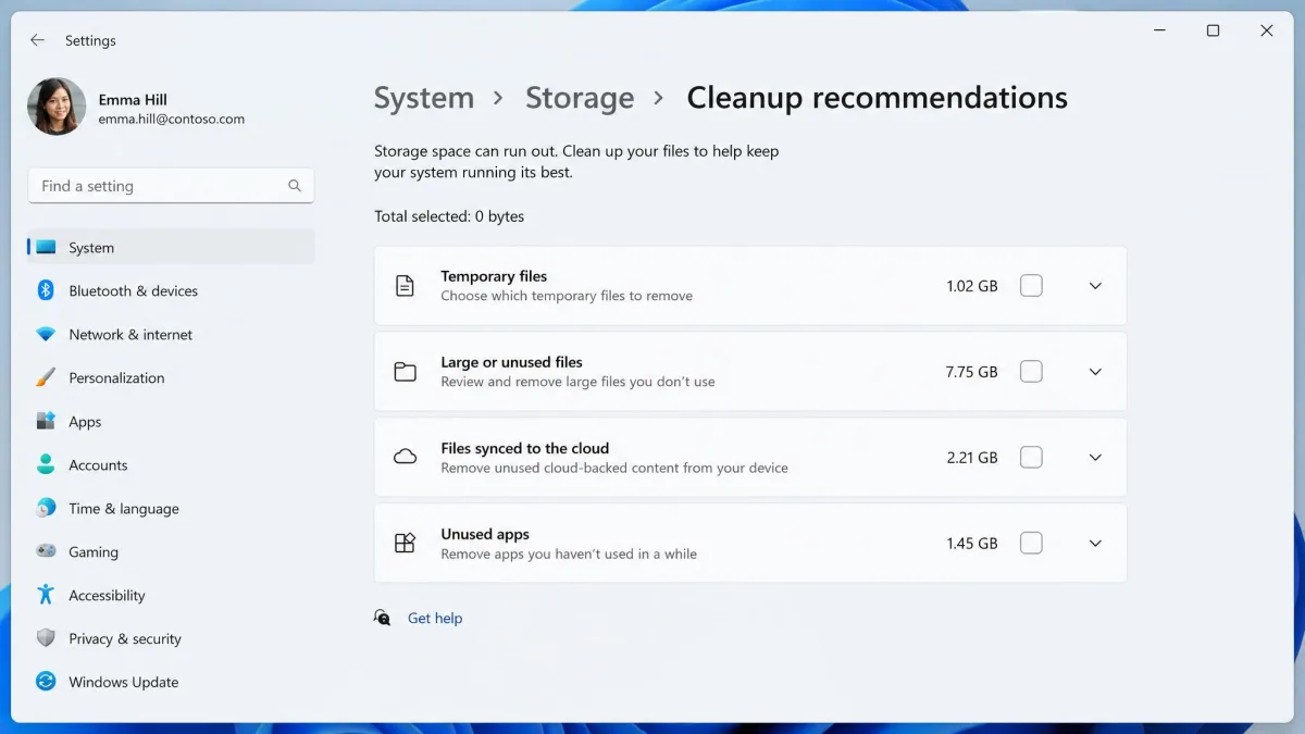 The Windows 11 Cleanup recommendations page with four expandable sections labelled Temporary files, Large or unused files, Files synced to the cloud, and Unused apps, each showing a selectable size total.