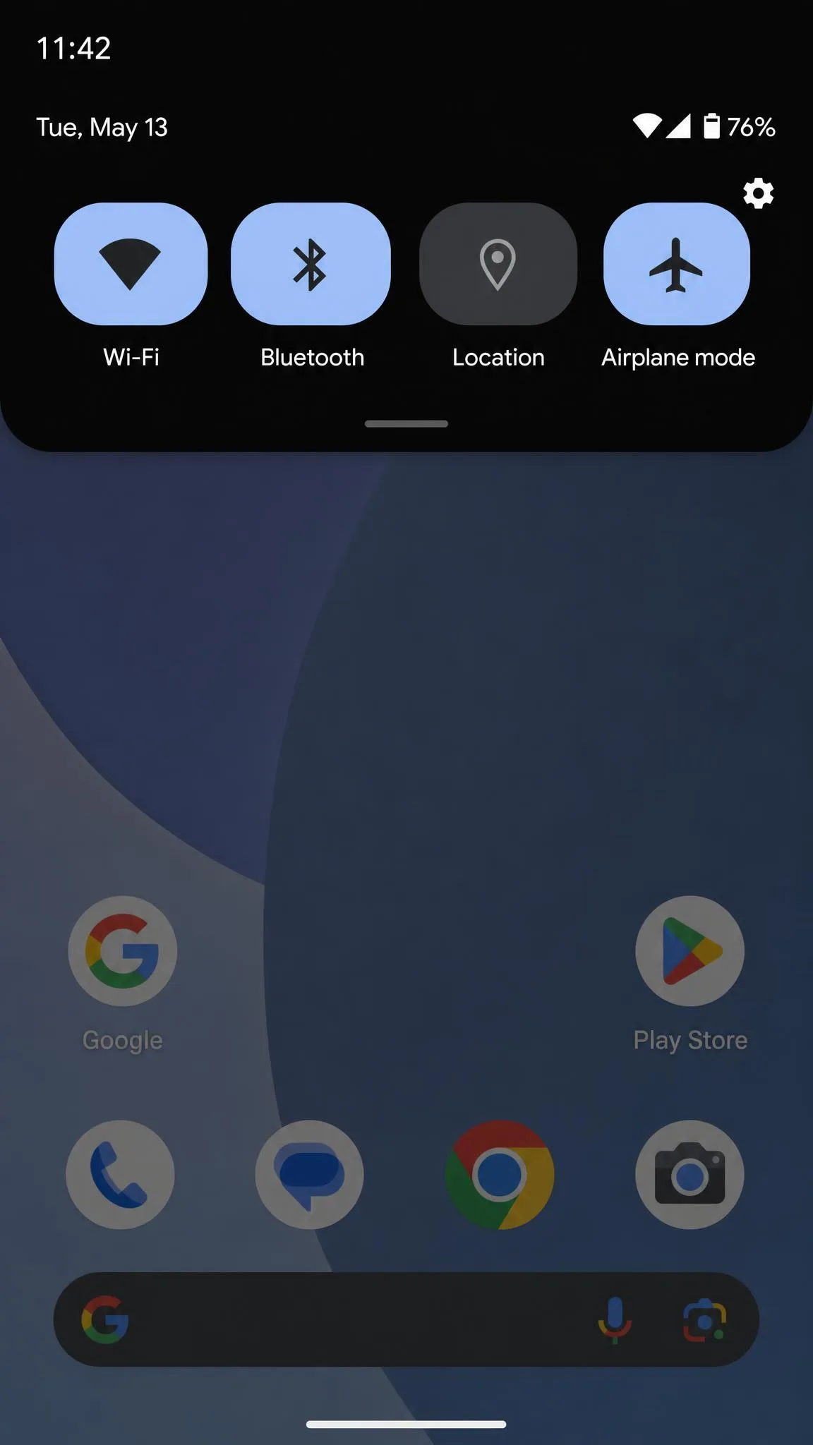 The Android Quick Settings panel pulled down at the top of the screen with the Location tile highlighted in the off state, next to Wi-Fi, Bluetooth, and airplane mode tiles.