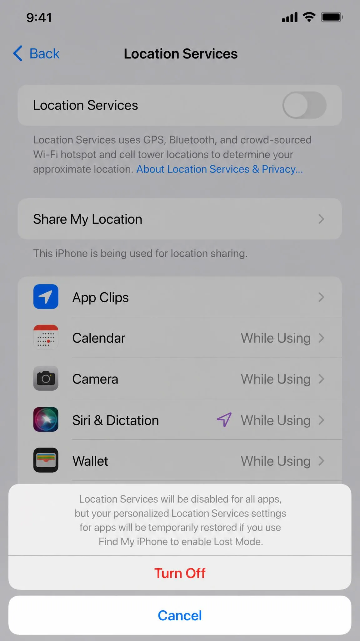 The iPhone Location Services settings screen with the master toggle switched off and the confirmation sheet warning that apps and system services will stop using location.