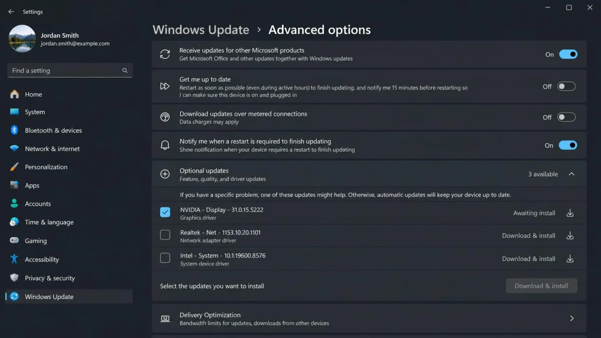 The Windows Update screen in Settings with Advanced options expanded and three optional driver updates listed, one of them a graphics driver awaiting install.