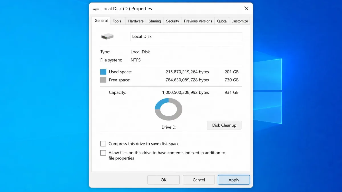 A drive Properties dialog in Windows with the checkbox allowing files on this drive to have contents indexed cleared and the Apply button highlighted.