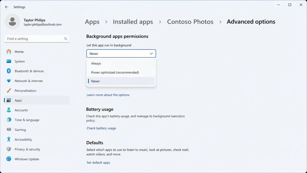 The Advanced options page for a Windows 11 app with the Background apps permissions dropdown open and Never selected.