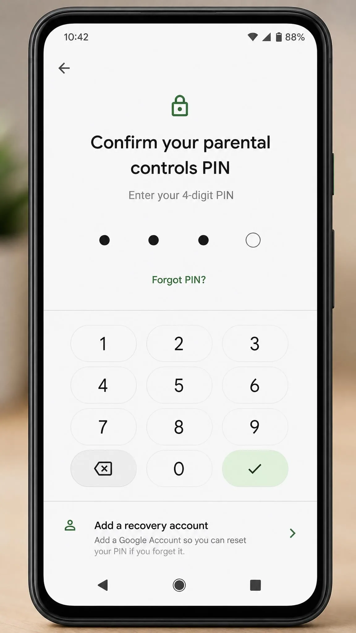 A close-up of an Android phone showing the four-digit parental controls PIN confirmation screen, with a keypad below and a prompt to add a recovery account underneath.