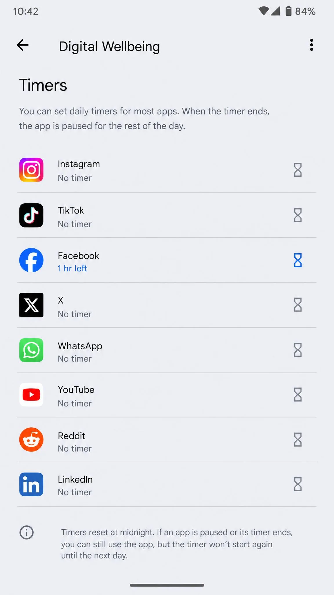 The Digital Wellbeing app timers screen on an Android phone listing installed apps, with a one-hour timer set on the social media app.