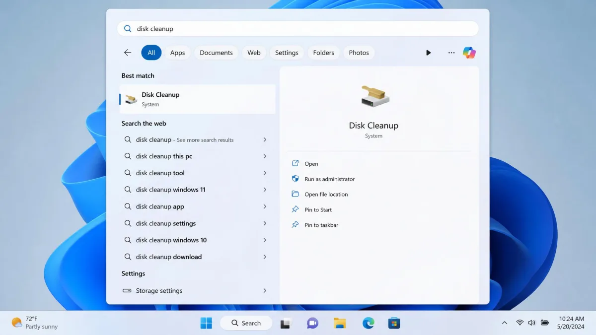 Windows 11 taskbar search results with "disk cleanup" typed in the box and the Disk Cleanup app highlighted as the Best match at the top of the list.