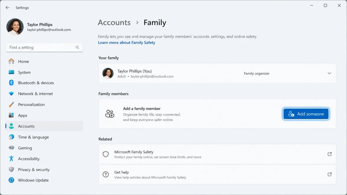 Windows 11 Settings app showing the Family accounts page, with the parent account listed and an Add someone button highlighted.