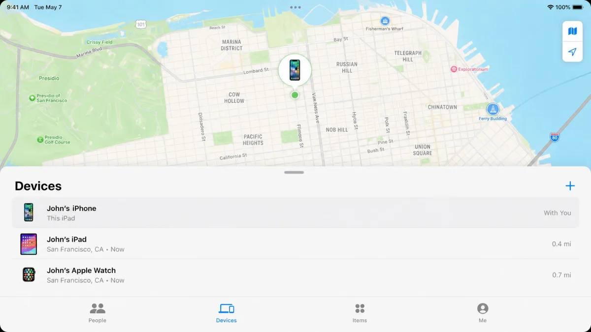 The Find My app Devices tab on an iPad, listing an iPhone, an iPad and an Apple Watch with a map above showing a green pin on the selected iPhone.