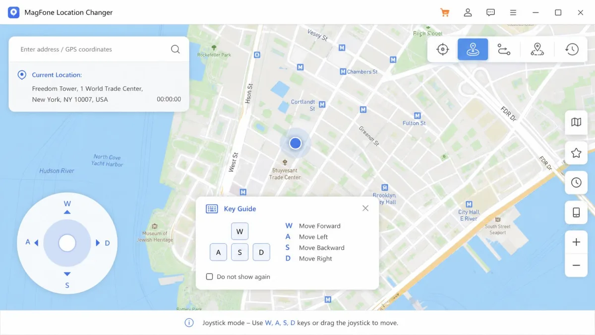 MagFone Location Changer joystick mode with the circular direction control in the corner of a city map and an on-screen key guide showing the W, A, S and D movement keys.