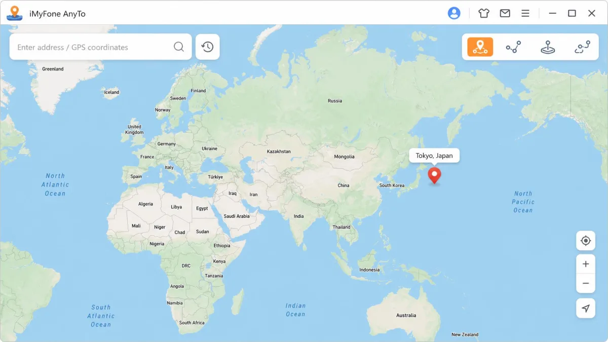 The iMyFone AnyTo desktop window showing a world map with a search bar at the top, the mode selector icons in the upper right corner, and a red location pin dropped on central Tokyo.