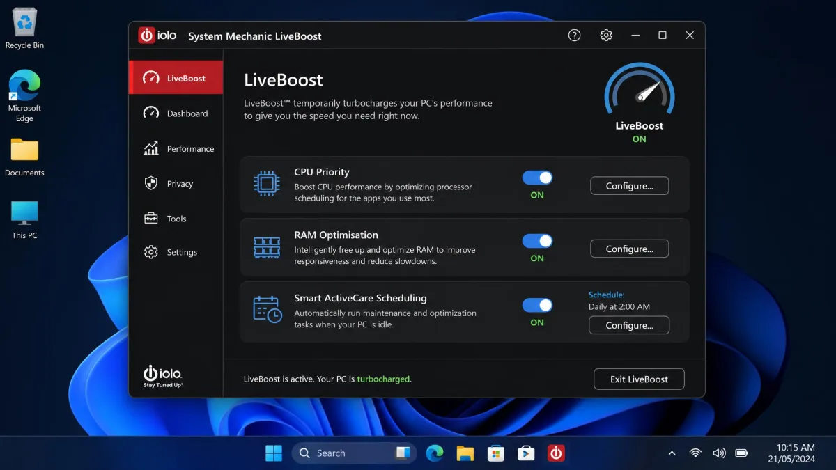 System Mechanic LiveBoost settings panel with toggles for CPU priority, RAM optimisation and Smart ActiveCare scheduling, shown on a Windows 11 desktop.