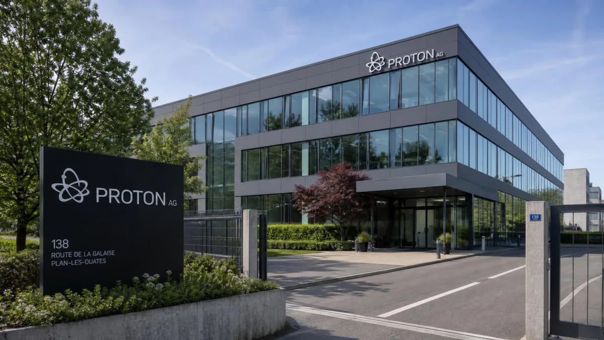 Exterior of Proton AG's office building in Plan-les-Ouates, Geneva, with the Proton logo on the entrance sign.