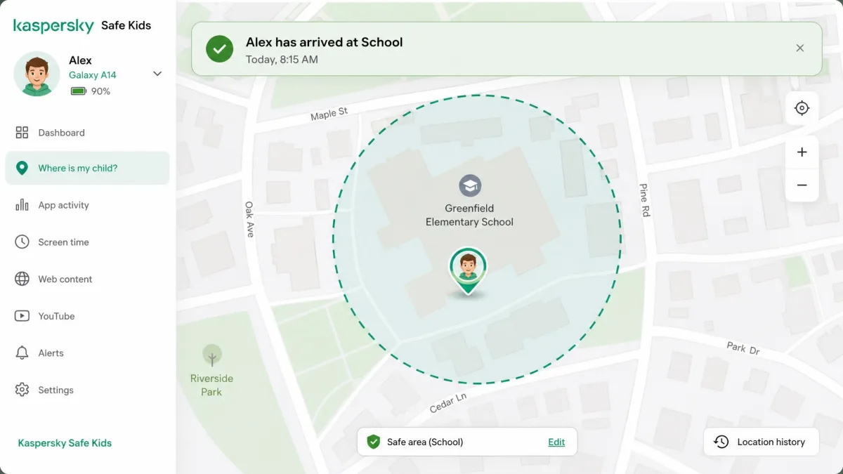 The Kaspersky Safe Kids map view showing a circular safe-area geofence drawn around a school with the child device pin inside it and an arrival alert banner.