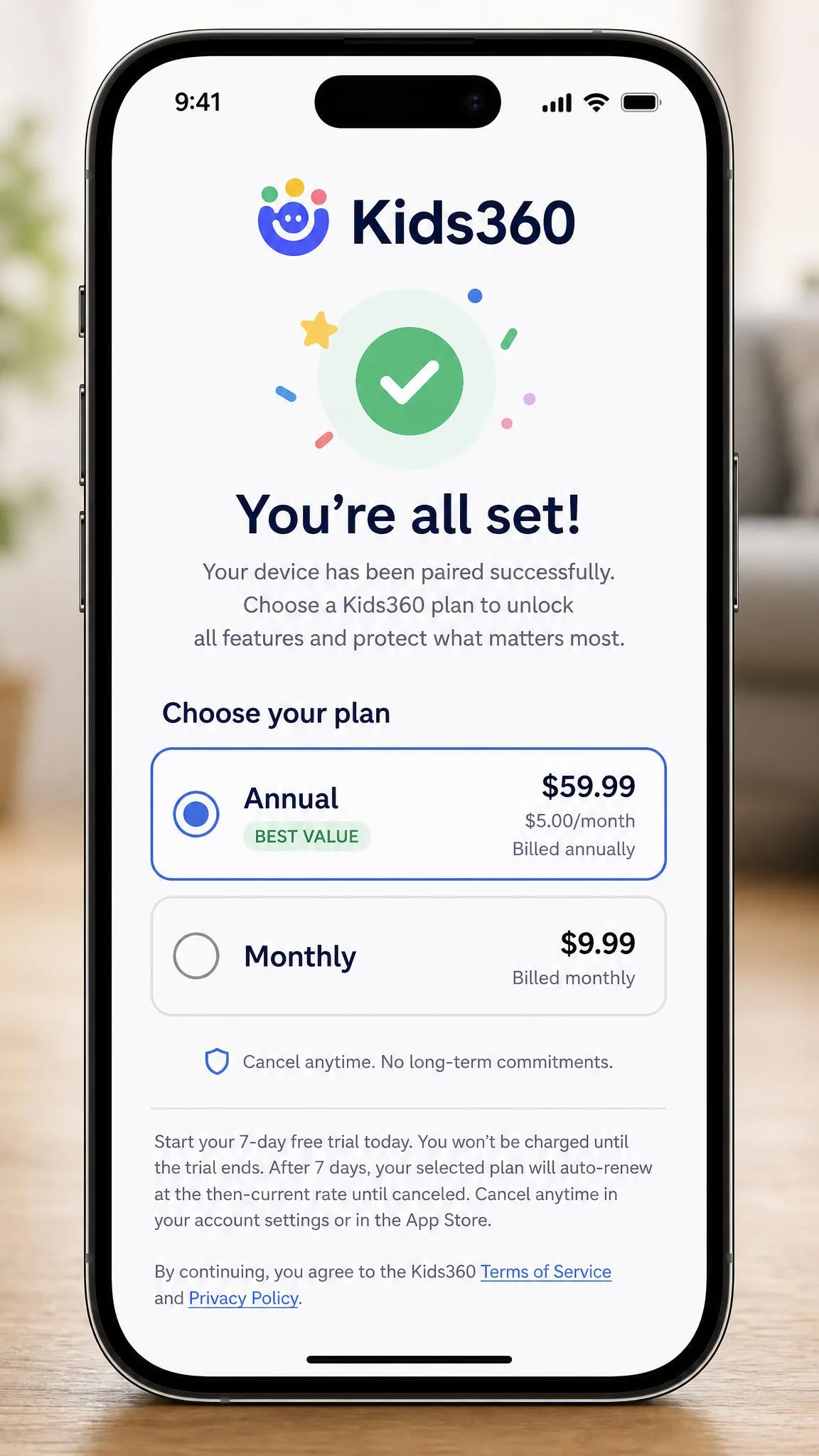 The Kids360 subscription screen appearing on a parent's iPhone after device pairing is complete, showing annual and monthly price tiers with the free trial terms in small print below.
